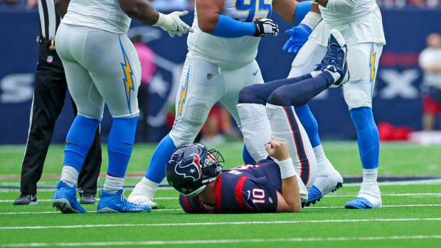 Los Angeles Chargers linebacker Khalil Mack (52) celebrates with Los Angeles Chargers defensive tackle Christian Covington (95) and Los Angeles Chargers defensive tackle Sebastian Joseph-Day (69)